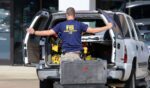 An FBI agent gathers evidence outside the Armed Forces Career Center in Chattanooga, Tennessee, on July 16, 2015.