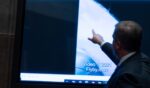 Then Deputy Director of Naval Intelligence Scott Bray points to a video display showing an Unidentified Anomalous Phenomena (UAP) during a hearing of the House Intelligence, Counterterrorism, Counterintelligece, and Counterproliferation Subcommittee hearing on Capitol Hill in Washington on May 17, 2022.