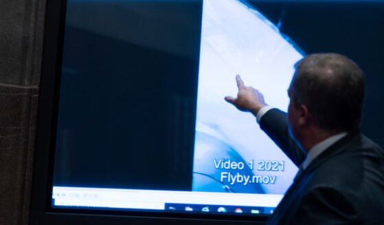 Then Deputy Director of Naval Intelligence Scott Bray points to a video display showing an Unidentified Anomalous Phenomena (UAP) during a hearing of the House Intelligence, Counterterrorism, Counterintelligece, and Counterproliferation Subcommittee hearing on Capitol Hill in Washington on May 17, 2022.