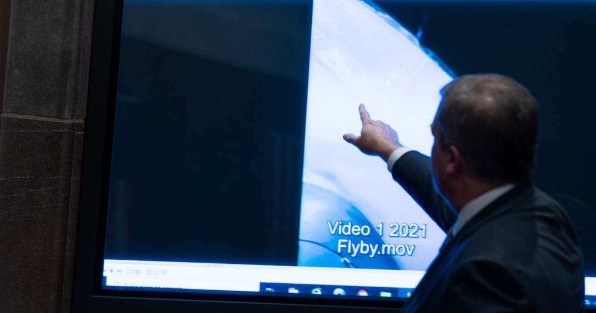 Then Deputy Director of Naval Intelligence Scott Bray points to a video display showing an Unidentified Anomalous Phenomena (UAP) during a hearing of the House Intelligence, Counterterrorism, Counterintelligece, and Counterproliferation Subcommittee hearing on Capitol Hill in Washington on May 17, 2022.
