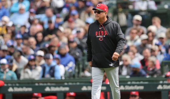 Manager Terry Francona of the Cincinnati Reds walks to the mound to make a pitching change during a match against the Chicago Cubs in Wrigley Field on May 7, 2026 in Chicago.