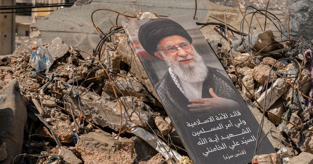 A portrait of Iran's former supreme leader, the now-deceased Ayatollah Ali Khamenei, sits on a pile of debris in the southern suburb of Dahieh, Lebanon on May 6, 2026.