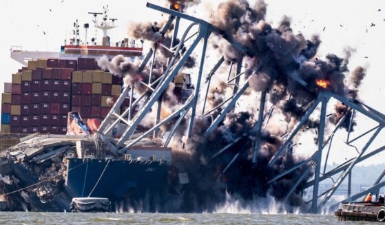 A crew conducts a controlled demolition of debris from the Francis Scott Key Bridge after the Dali container ship crashed into it in Baltimore on May 13, 2024.