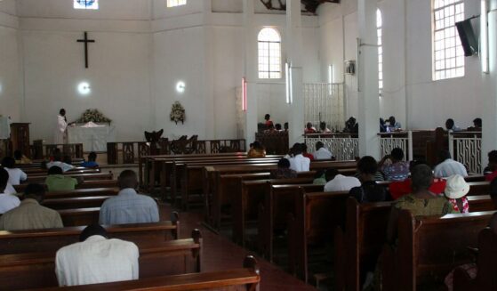 Christians sit in the pews of a Pentecostal church in Kampala, Uganda on July 20, 2009.