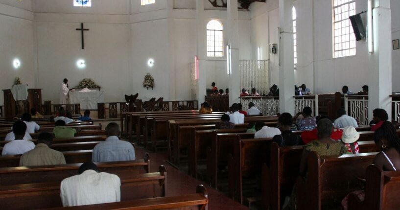 Christians sit in the pews of a Pentecostal church in Kampala, Uganda on July 20, 2009.