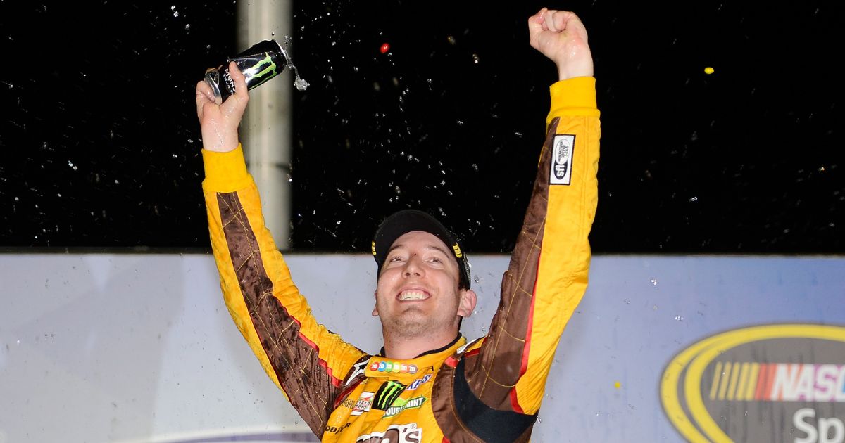 Driver Kyle Busch celebrates in the victory lane after winning the NASCAR Sprint Cup Series AdvoCare 500 at Atlanta Motor Speedway on Sept. 1, 2013 in Hampton, Georgia.