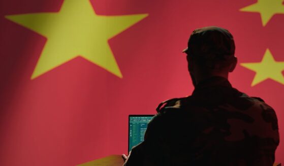 A Chinese engineer works on a computer.