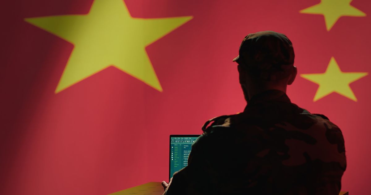 A Chinese engineer works on a computer.