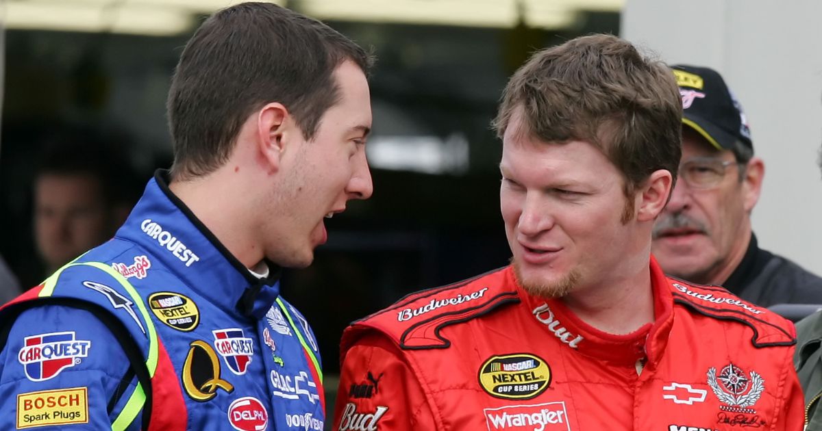 Driver Kyle Busch talks to driver Dale Earnhardt Jr. in the garage during NASCAR testing at Las Vegas Motor Speedway on Jan. 30, 2007 in Las Vegas.