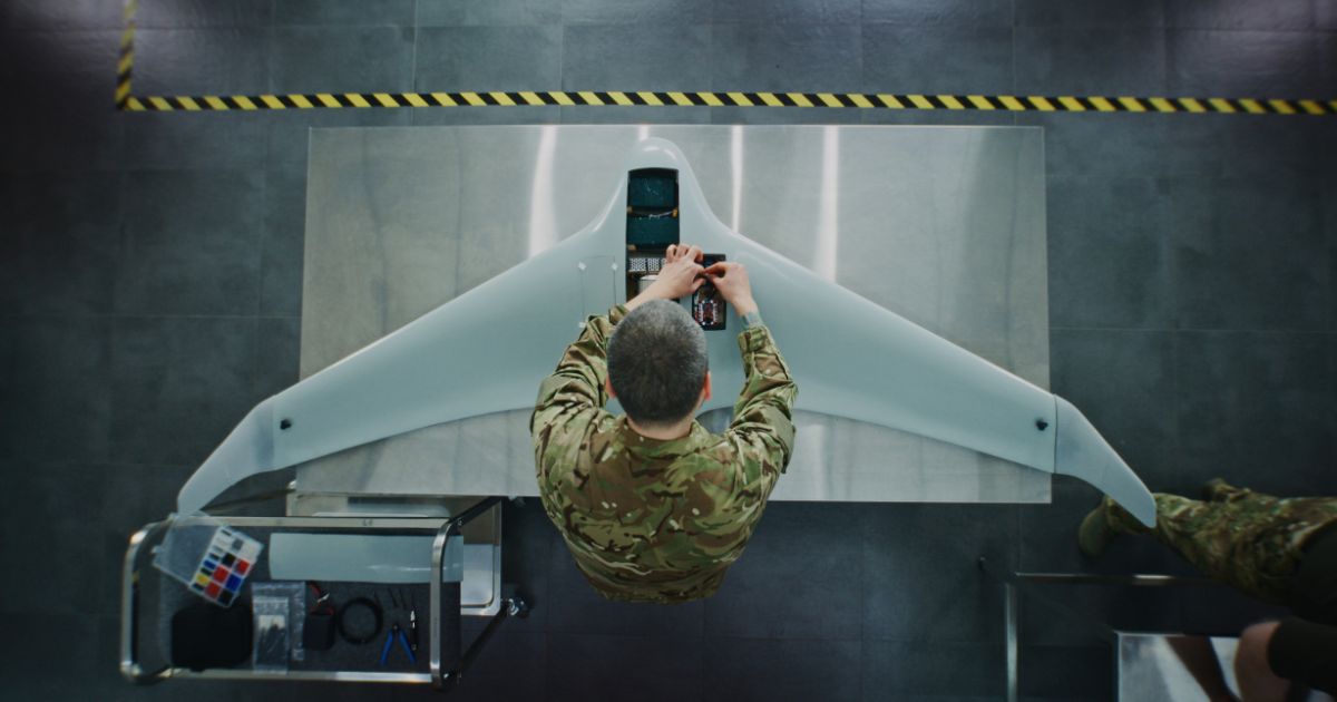 An engineer works on a drone.