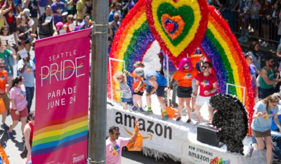 A parade float goes by at a Seattle Pride Parade in downtown.