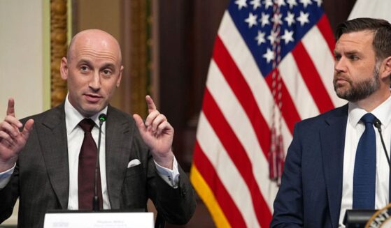 White House Deputy Chief of Staff Stephen Miller, left, speaks as Vice President J.D. Vance looks on during a roundtable discussion on anti-fraud initiatives Tuesday. Miller said the U.S. could balance the federal budget by eliminating all of the fraud in government programs.