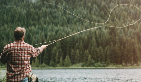 Scenes like this one of a man fly fishing in an Oregon lake may soon be a thing of the past, as animal rights actviists have gathered enough signatures to get a measure on November's ballot that would ban hunting and fishing.