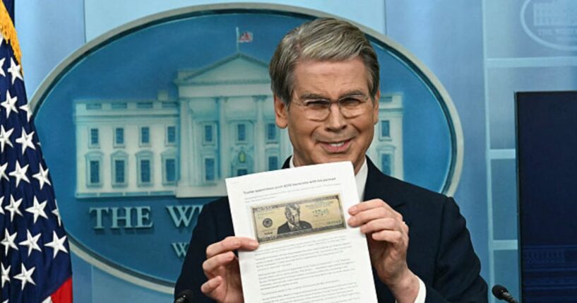 Treasury Secretary Scott Bessent shows a proposed $250 bill featuring President Donald Trump during a press briefing Thursday at the White House in Washington, D.C.