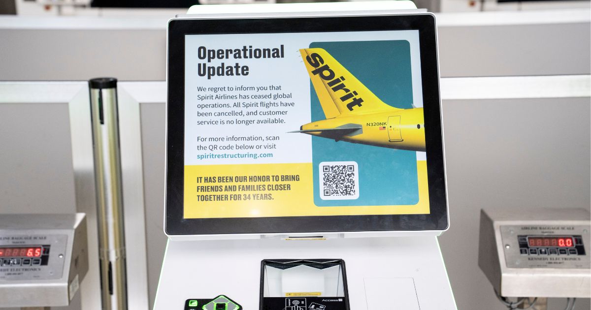 The Spirit Airlines ticket counter at Detroit Metro Airport is closed down after the airline shut down Saturday in Romulus, Michigan.