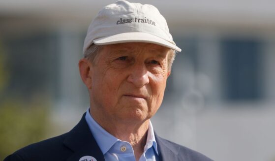 California gubernatorial candidate Tom Steyer, a Democrat, sports a hat that reads "class traitor" during a May 18 rally in Los Angeles