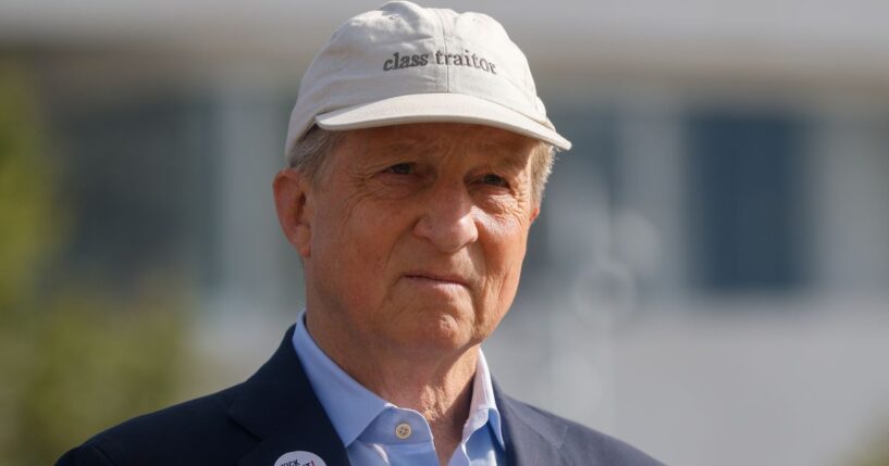 California gubernatorial candidate Tom Steyer, a Democrat, sports a hat that reads "class traitor" during a May 18 rally in Los Angeles