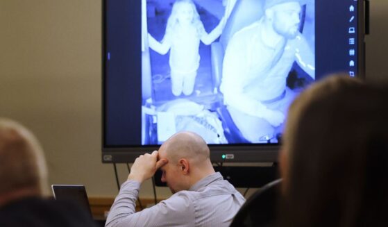 Defendant Tanner Horner reacts April 7 during testimony at the Tim Curry Criminal Justice Center in Fort Worth, Texas. Horner pleaded guilty to capital murder in the November 2022 strangulation killing of 7-year-old Athena Strand. The child is pictured in the video on the screen in the courtroom as Horner drives his FedEx truck.