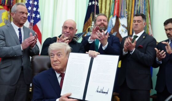 President Donald Trump shows his signature in the Oval Office after signing an executive order April 18 directing the Food and Drug Administration to issue new guidance on the use of psychedelic drugs intended for clinical trials for U.S. veterans suffering from Post Traumatic Stress Disorder.