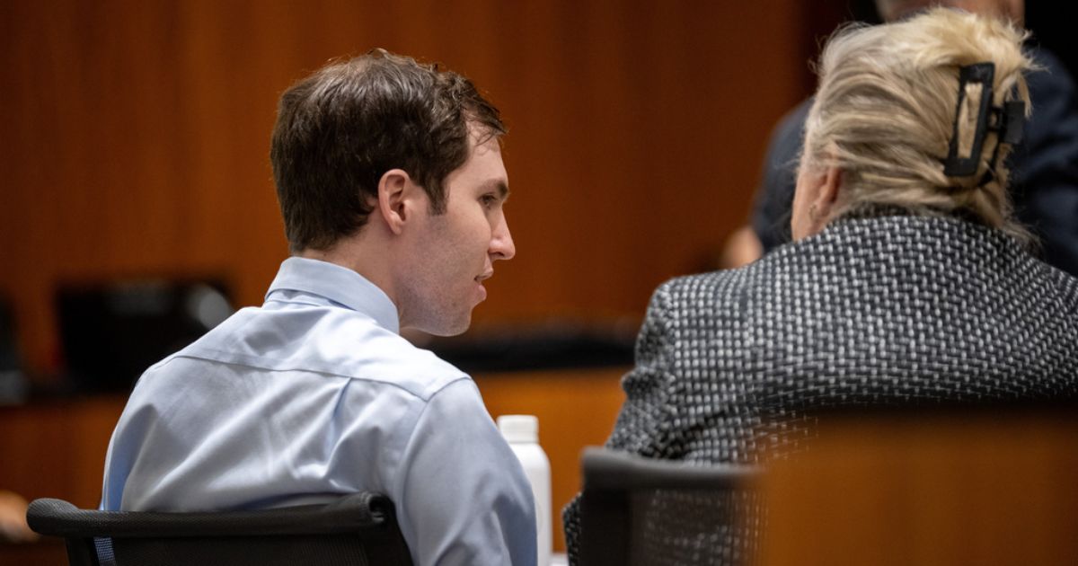 Tyler Robinson, left, speaks with his attorney Kathryn Nester in 4th District Court in Provo, Utah, on April 17.