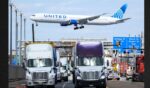 A United Airlines Boeing 767 passenger aircraft approaches Newark Liberty International Airport as trucks travel near the Port Newark Container Terminal in Newark, New Jersey, in a file photo dated April 8, 2025.