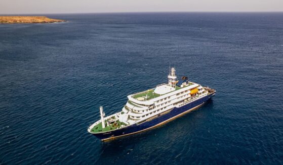 This aerial picture shows a general view of the cruise ship MV Hondius stationary off the port of Praia, the capital of Cape Verde, on May 3, 2026.