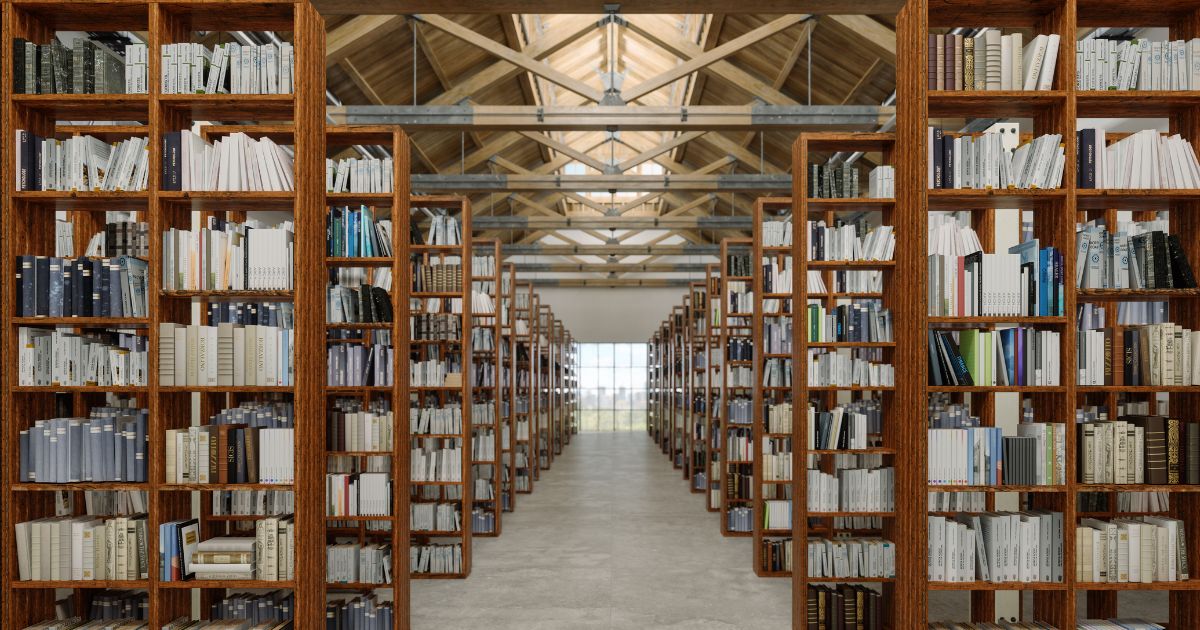 A library interior with books on wooden bookshelves.