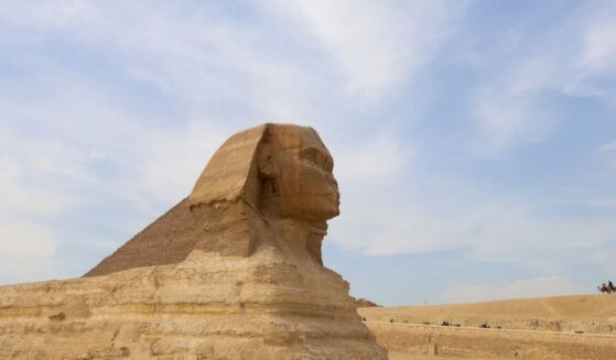 Tourists ride camels near the Sphinx and the Pyramid of Khafre or Chephren, a UNESCO World Heritage site, in Giza on the outskirts of Cairo, Egypt, on Feb. 25, 2025.