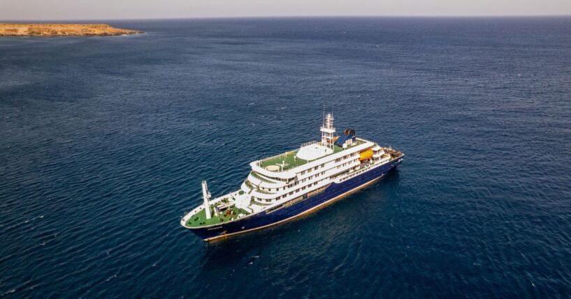 This aerial picture shows a general view of the cruise ship MV Hondius stationary off the port of Praia, the capital of Cape Verde, on May 3, 2026.
