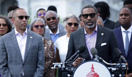House Minority Leader Hakeem Jeffries looks on as NAACP President Derrick Johnson speaks during a news conference in opposition to the SCORE Act in front of the U.S. Capitol on May 19, 2026, in Washington, D.C.