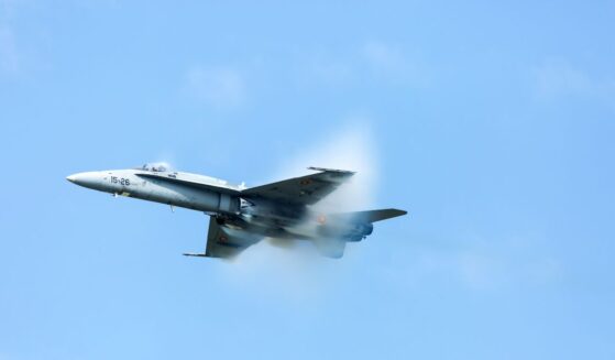An F-18 Super Hornet at air show SIAF 2017 with a steam cone around the plane on Aug. 26, 2017.