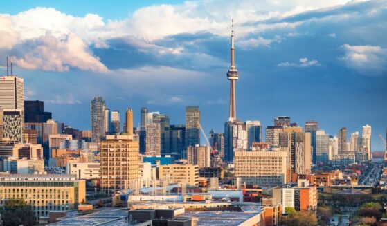 The Toronto financial district and Spadina avenue skyline on a partially cloudy springtime evening after a rain storm.