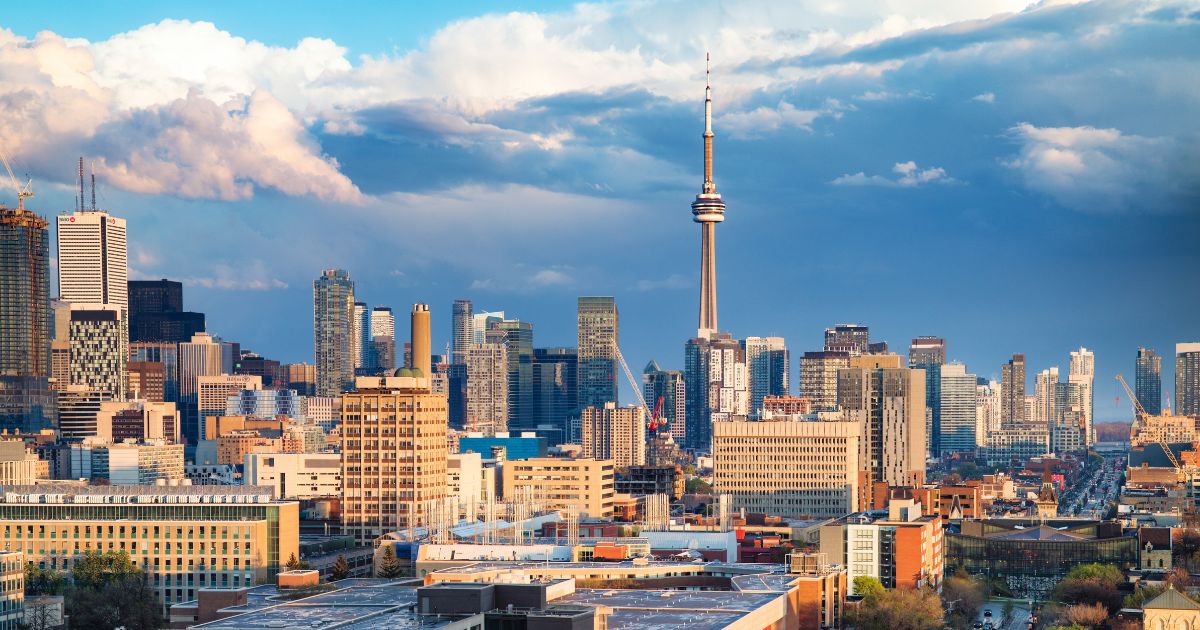 The Toronto financial district and Spadina avenue skyline on a partially cloudy springtime evening after a rain storm.