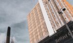 The high rise tower of Belfast City Hospital and adjacent to it the smokestack of the hospital's incinerator in Belfast, Northern Ireland, on March 23, 2019.
