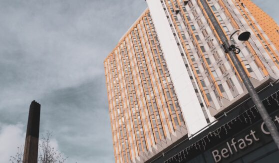 The high rise tower of Belfast City Hospital and adjacent to it the smokestack of the hospital's incinerator in Belfast, Northern Ireland, on March 23, 2019.