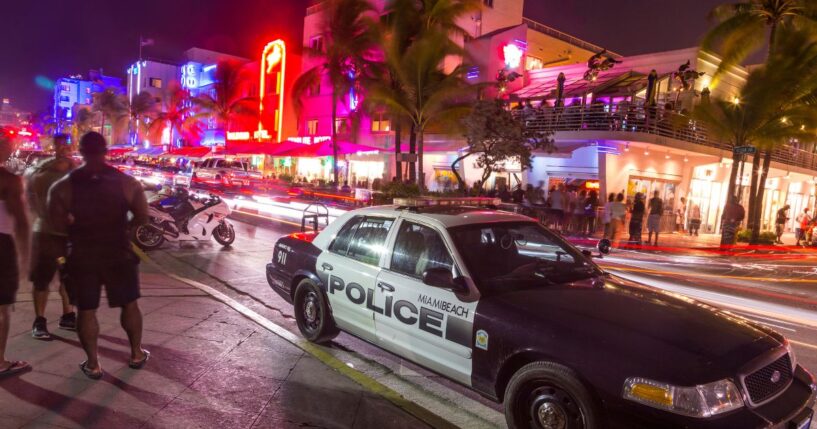 A police car parks at Ocean Drive along South Beach Miami in the historic Art Deco District on Aug. 30, 2014, in Miami, Florida.