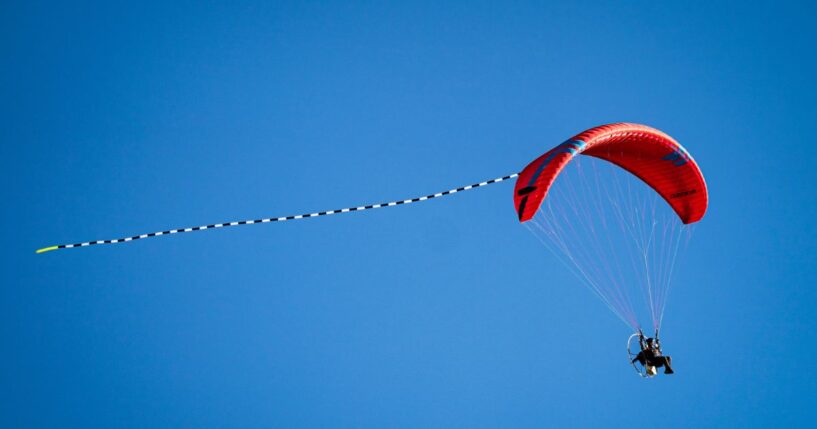 A paraglider flies through the sky on March 21, 2026, in Torrington, Wyoming.
