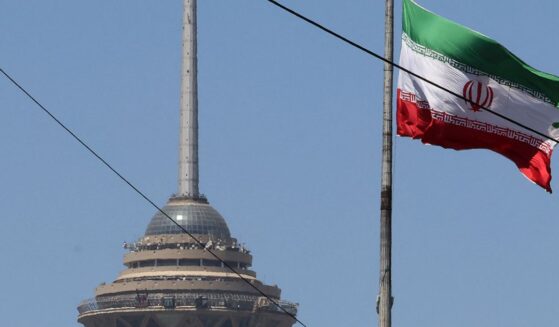 The Iranian flag flutters near the Milad Tower, part of the International Trade and Convention Center of Tehran, in the capital on May 25, 2026.
