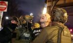 Federal agents with Homeland Security Investigations detain a protestor wearing an "Antifa" shirt outside a residential building in Minneapolis, Minnesota, on Feb. 5, 2026.