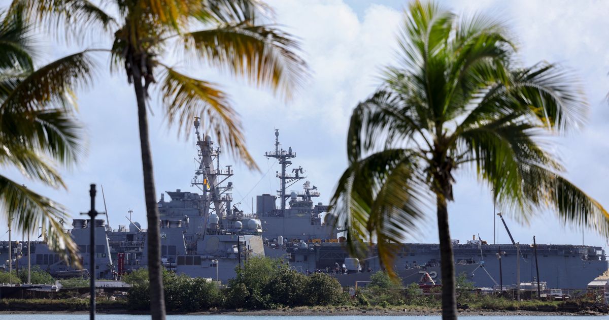 The USS Mahan, an Arleigh Burke-class guided-missile destroyer, is docked at the port of Ponce, Puerto Rico, with the USS Iwo Jima, a US Navy Wasp-class amphibious assault ship, in the background on Jan. 15, 2026.