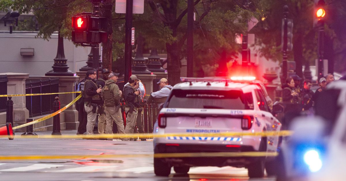 Emergency teams work the scene after multiple gunshots ring out outside the White House on May 23, 2026, in Washington, D.C.