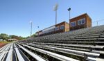 Stadium seats at an outdoor track.