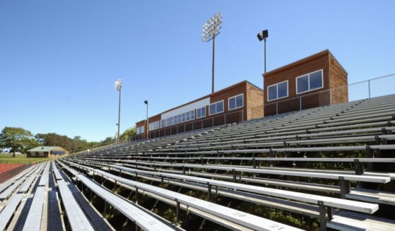 Stadium seats at an outdoor track.