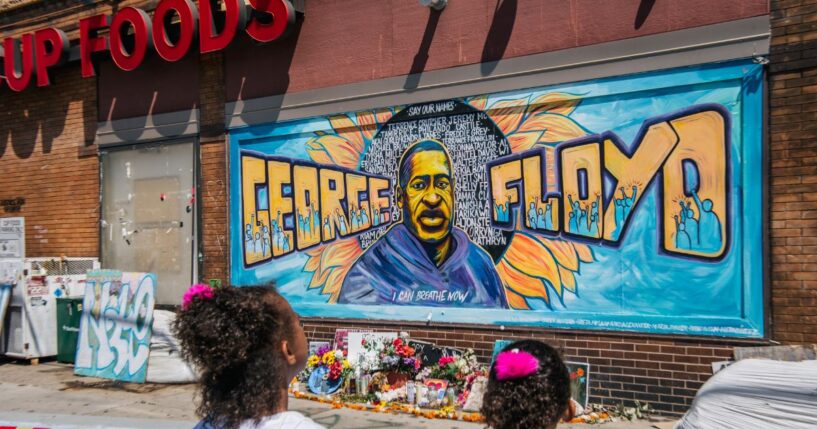 Jordan and Royal Pacheco learn of George Floyd's murder at the intersection of 38th Street and Chicago Avenue, ahead of former Minneapolis police officer Derek Chauvin's sentencing, on June 25, 2021, in Minneapolis, Minnesota.