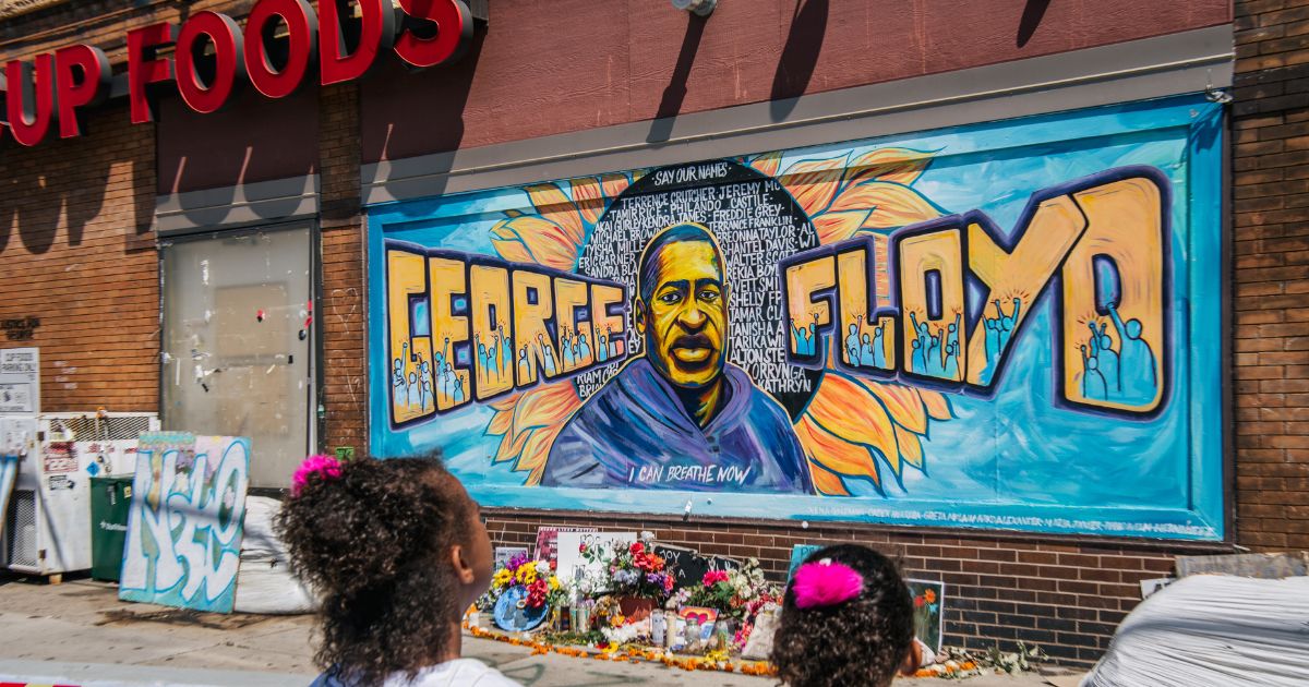 Jordan and Royal Pacheco learn of George Floyd's murder at the intersection of 38th Street and Chicago Avenue, ahead of former Minneapolis police officer Derek Chauvin's sentencing, on June 25, 2021, in Minneapolis, Minnesota.