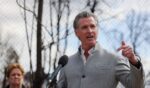 Gov. Gavin Newsom speaks at a press conference at Odyssey Charter School as work begins to remove debris from the Eaton Fire in Altadena, California.