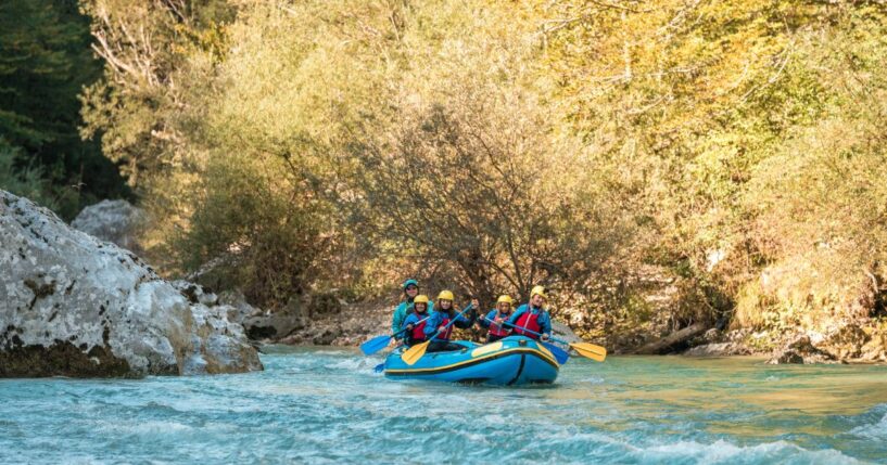 A young family with a mother guiding her three kids on a rafting expedition.