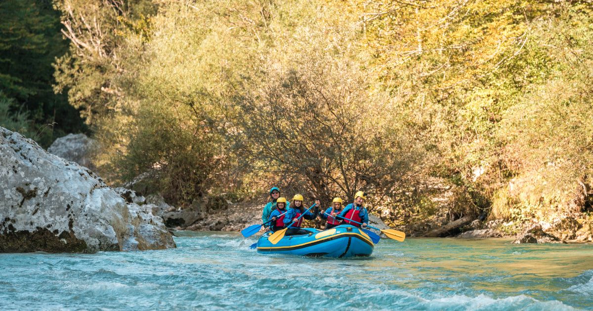 A young family with a mother guiding her three kids on a rafting expedition.