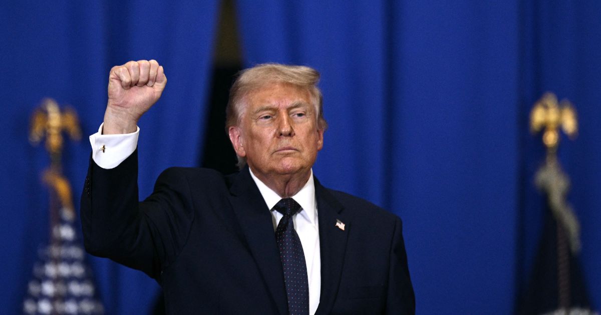 President Donald Trump raises a fist as he departs after delivering a speech about the economy at Rockland Community College Fieldhouse in Suffern, New York, on May 22, 2026.