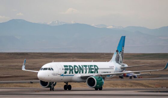 A Frontier Airlines Airbus A320neo plane, owned by the Bank of Utah Trustee, taxis to a gate at Denver International Airport on March 23, 2026, in Denver, Colorado.
